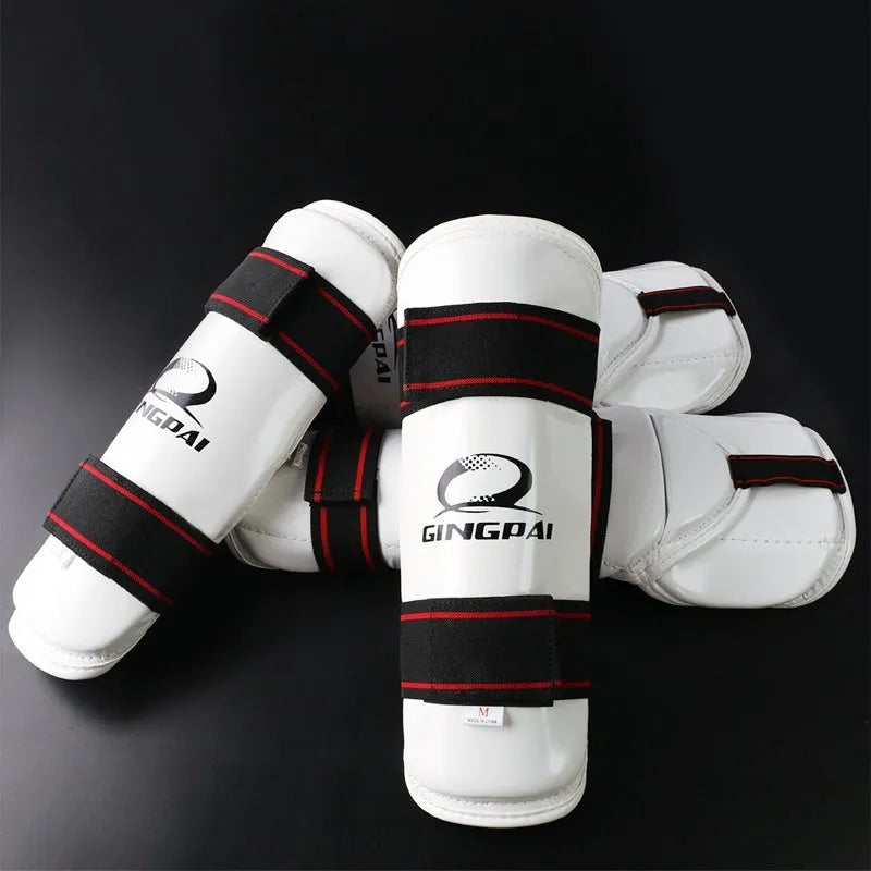 Taekwondo protective gear set showing arm guards, elbow protectors and legguards in PU EVA foam construction