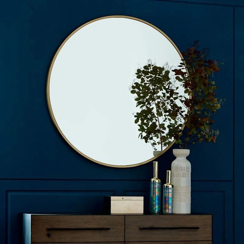 Round metal framed bathroom wall mirror in Nordic style available in black, white or gold