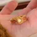Women's geometric open ring with pink crystal enamel on gold-plated copper band