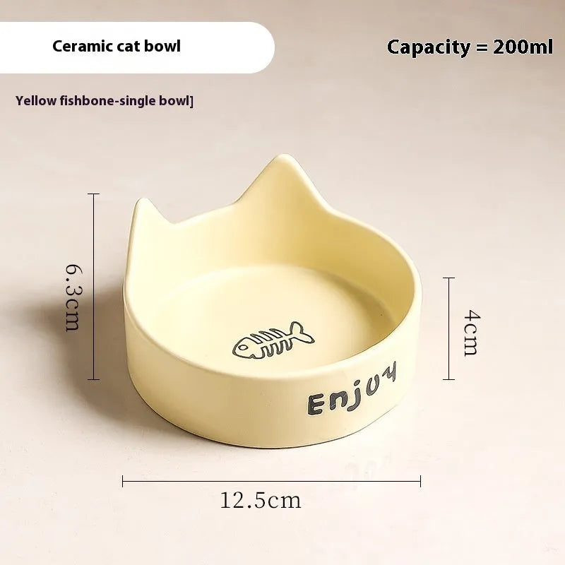 Porcelain cat bowl with cat ear and paw design on a wooden feeding frame, in pink colour.
