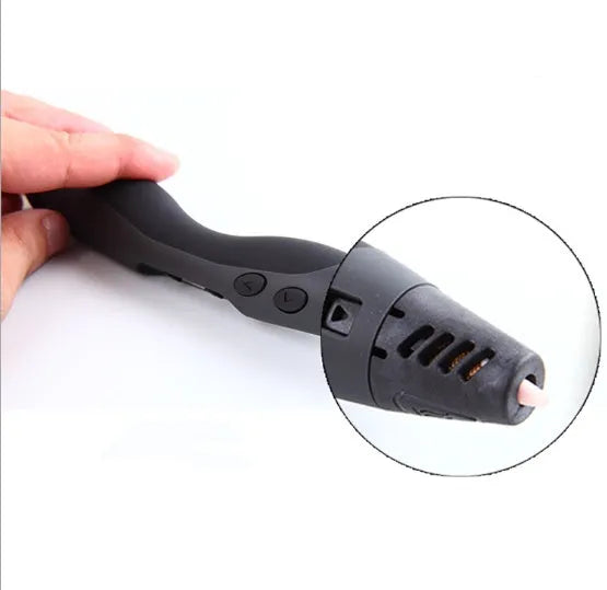 3D painting graffiti pen in black plastic, 180mm long, on a flat surface with coloured filament