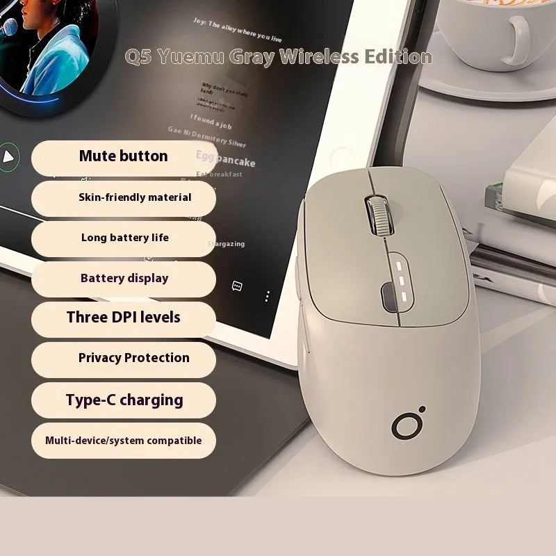 Compact mute wireless Bluetooth mouse in matcha green colour on a wooden desk