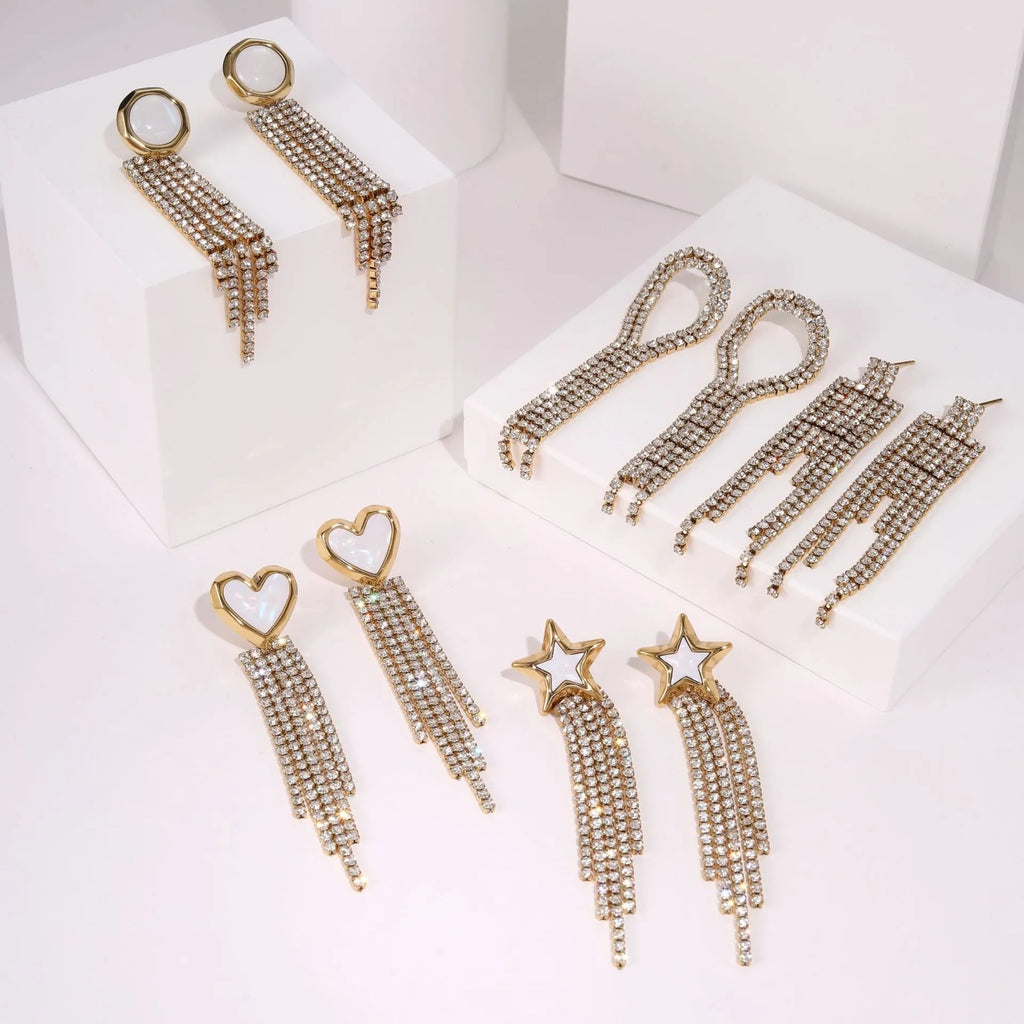 Women's stainless steel earrings with 18K electroplated gold finish showing heart and star shape designs