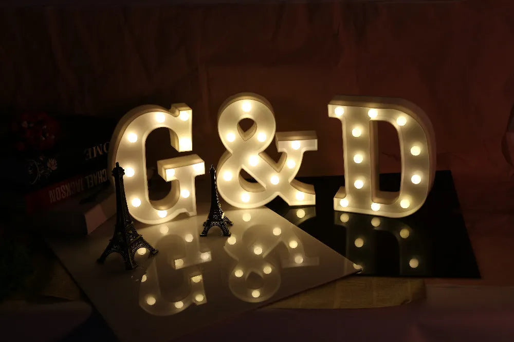 White plastic LED marquee letter sign with warm white glow, 22cm tall