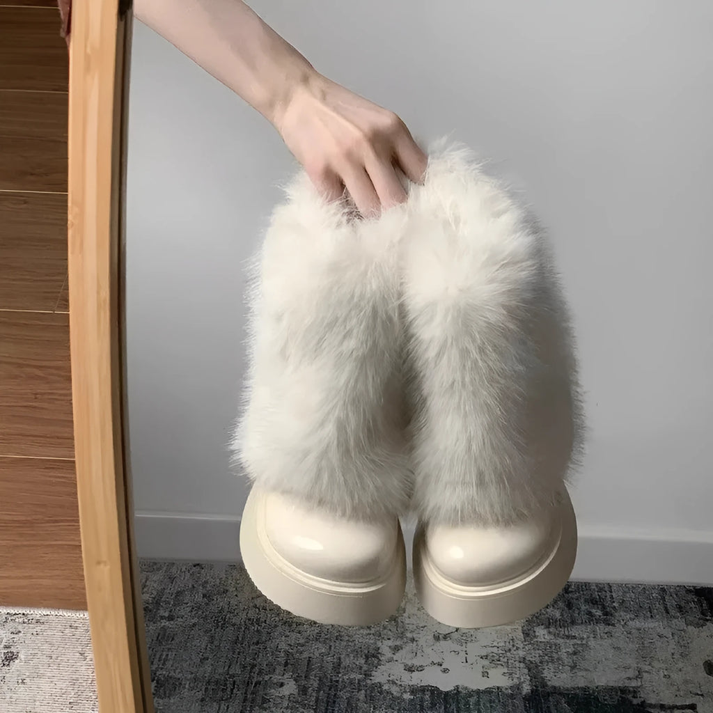Women's black low-top snow boots with plush fleece lining and a waterproof rubber platform sole