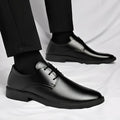 Men's black round toe pointed cap low top PU formal shoes with stitched detailing on white background