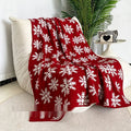 Personalised Christmas blanket with reindeer or snowflake pattern in two sizes.