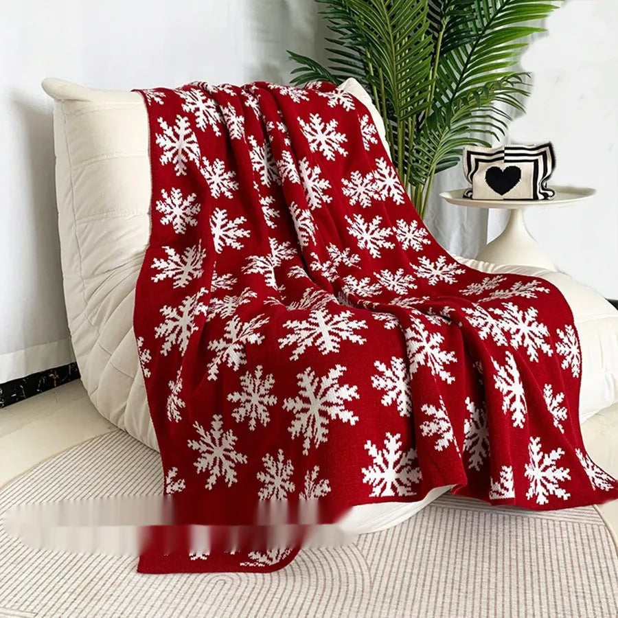 Personalised Christmas blanket with reindeer or snowflake pattern in two sizes.