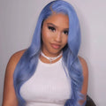 A woman wearing a long body wave human hair lace front wig with a natural hairline.