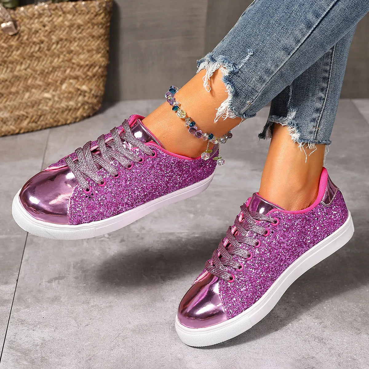 Women's plus size black sequined lace-up board shoes with flat rubber sole.