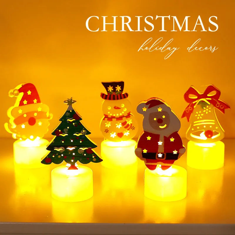 Assorted LED electronic candles featuring Christmas tree, Santa Claus, and snowman designs on a table