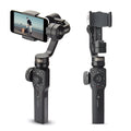 Black handheld smartphone gimbal stabiliser for video filming on a dark background.
