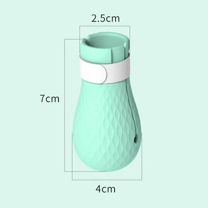 Green silicone cat foot covers with nylon buckle strap and leak hole design, set of 4 pieces on a white background