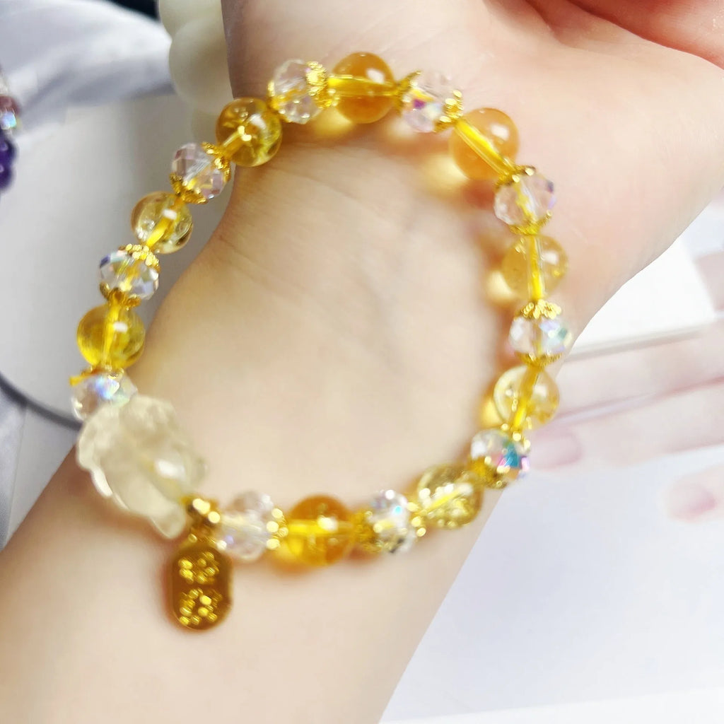 Handmade citrine crystal bracelet with a detailed nine-tail fox charm on a gold-toned chain.