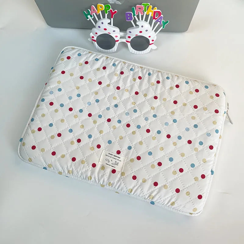 Women's polka dot laptop bag in polyester with breathable construction showing size options