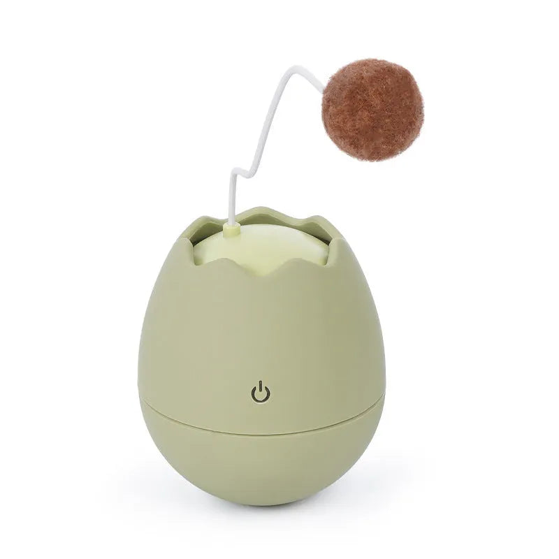 Funny cat artifact toy in green, made from ABS plastic, size 7x7x9cm, with cotton ball feature