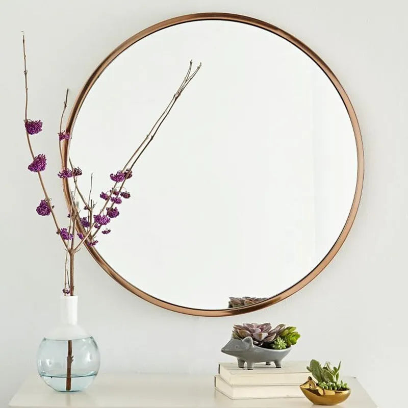 Round metal framed bathroom wall mirror in Nordic style available in black, white or gold