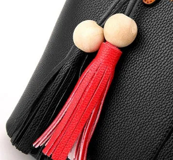 Women's PU leather crossbody shoulder bag in Black with silver-tone clasp, worn over shoulder