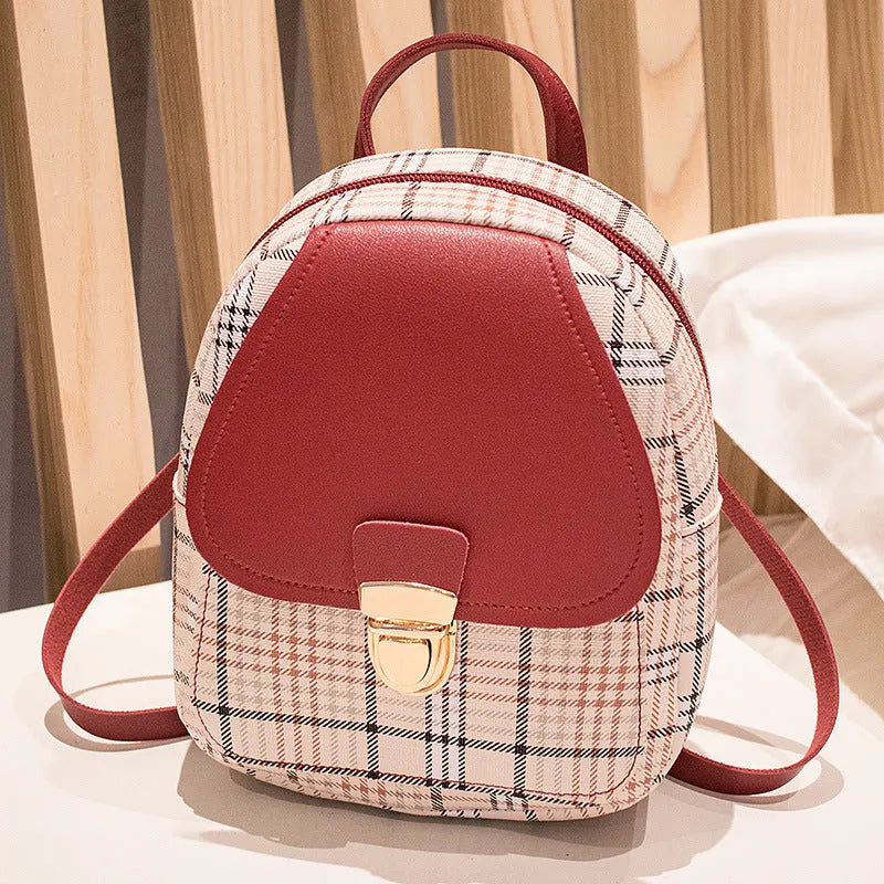 A one shoulder diagonal phone bag made from PU leather, shown in one of five colour options.