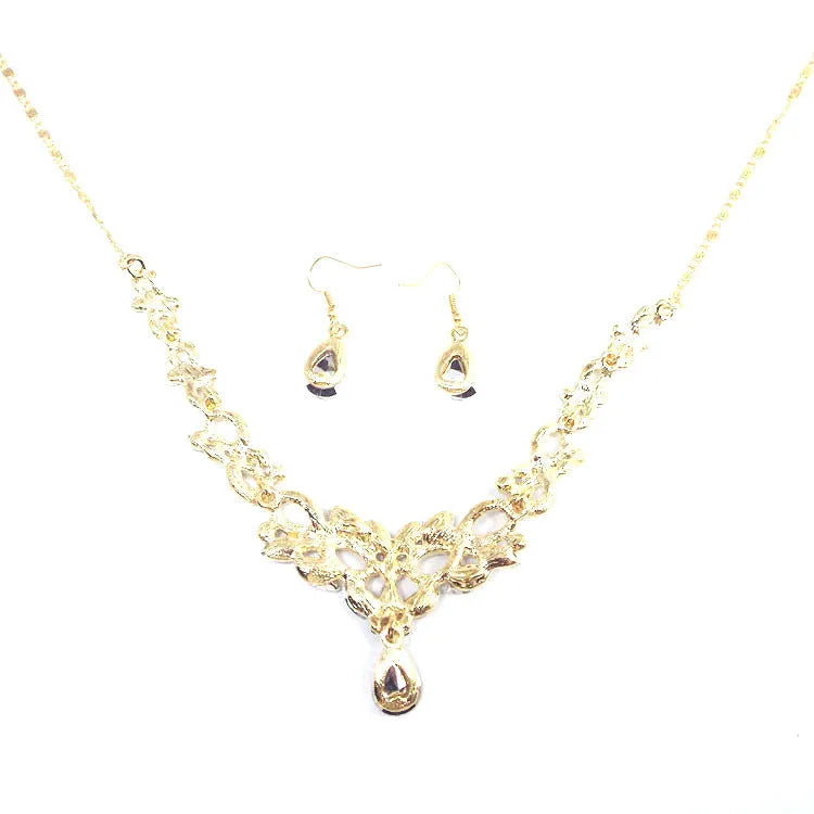 Gold alloy clavicle chain necklace with bow pendant on display