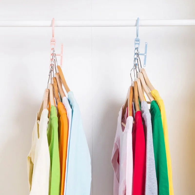 Blue revolving wardrobe hanger with five arms and a central handle for space-saving clothes storage.