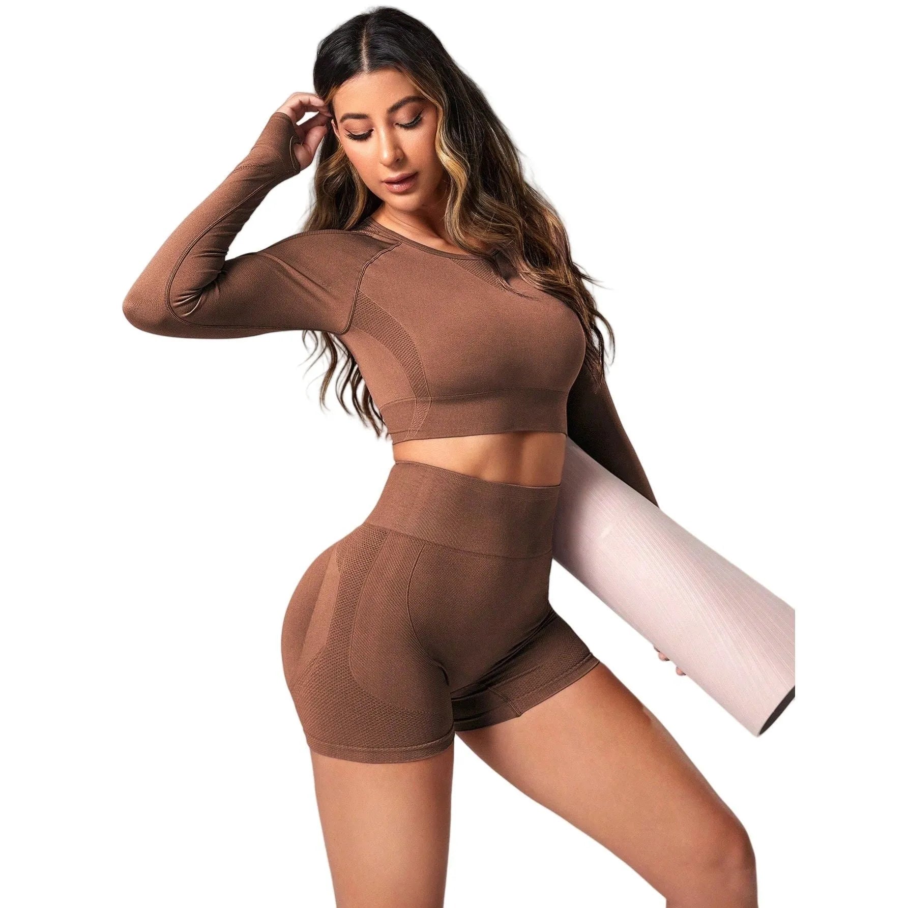 Women's high-waisted yoga suit set in black, featuring a long-sleeved top and tight leggings.