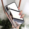 Black iPhone case with a reflective mirror surface on the back, compatible with iPhone 7, 8 Plus, and X models.