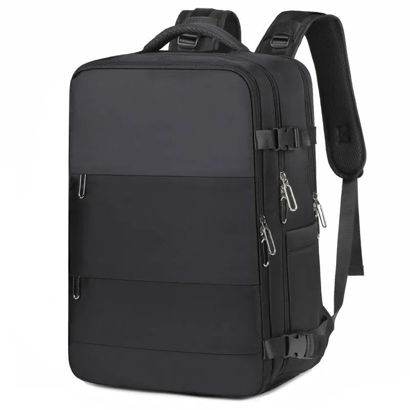Large purple travel backpack with multiple compartments open, showing laptop sleeve and organiser pockets.