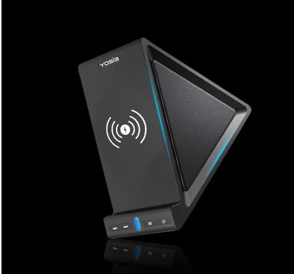 Black multifunctional Bluetooth speaker with integrated phone stand and wireless charging pad, showing size relative to a mobile phone.