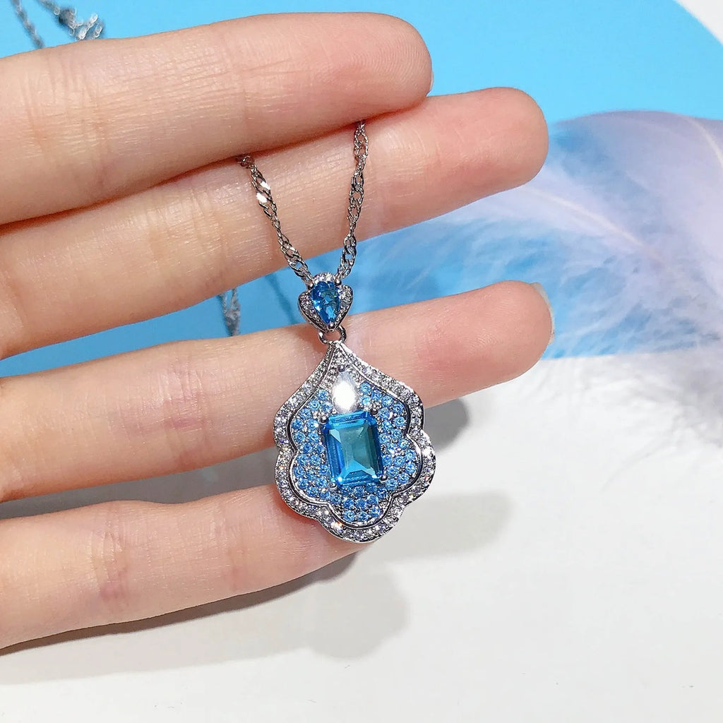 Sea blue geometric copper pendant with aquamarine and topaz mirror finish jewellery piece