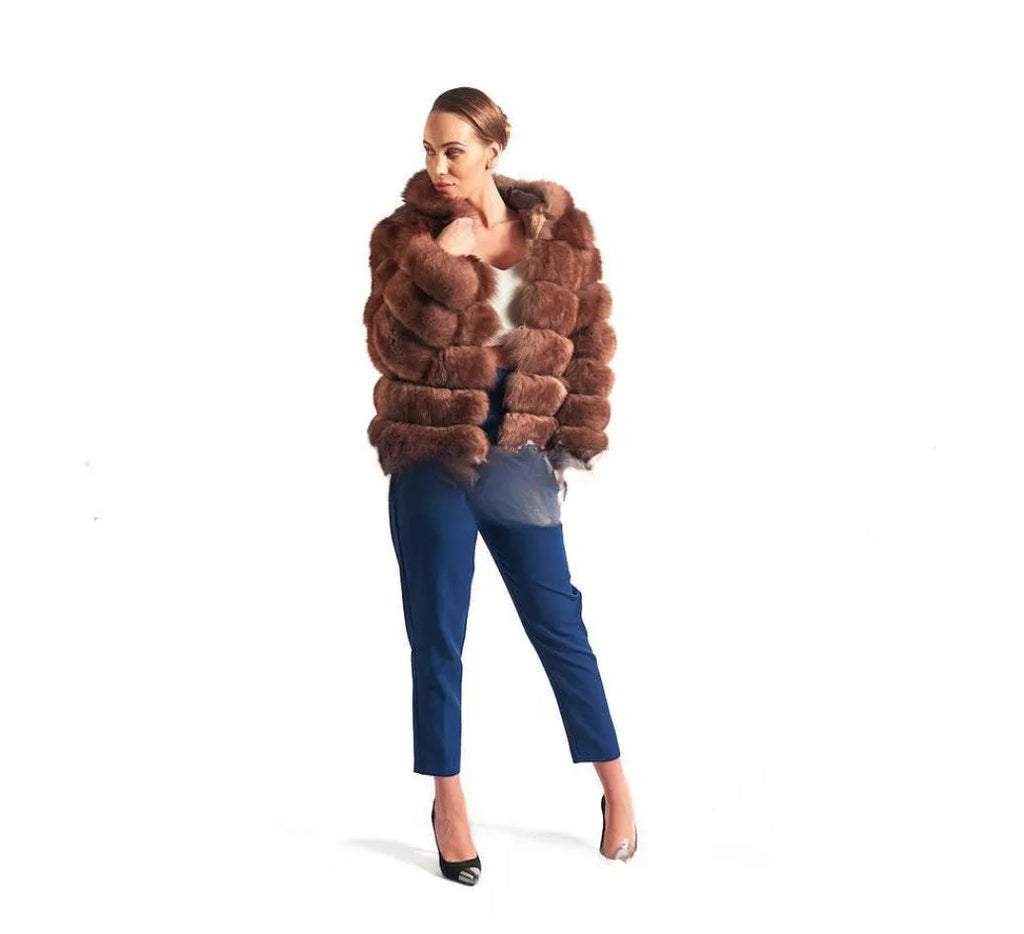 Women's loose fit artificial fur hooded coat in white silver fox colour on a hanger.