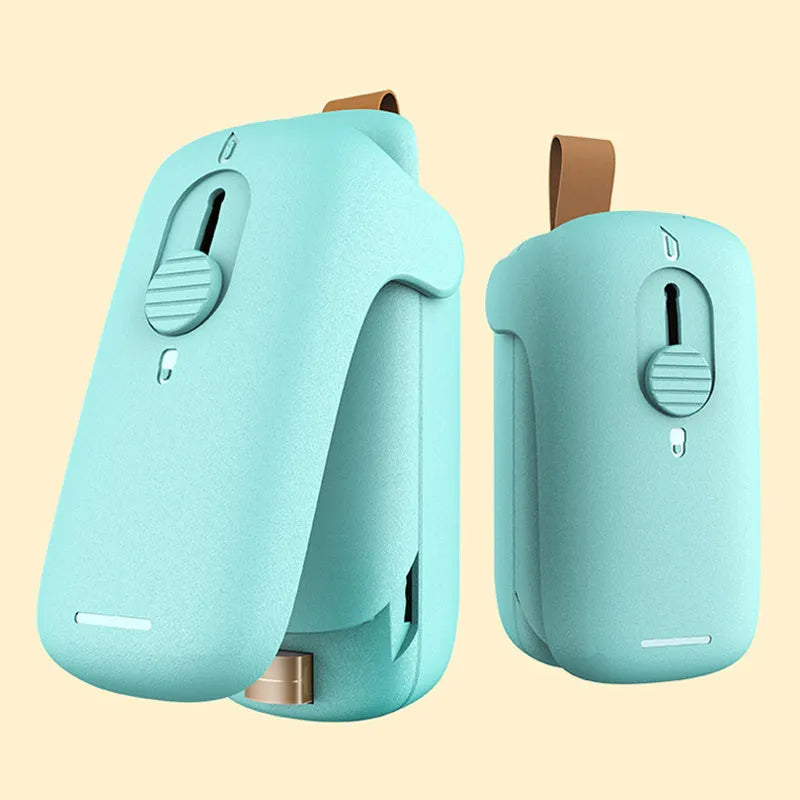 Mini hand pressure heat sealing machine in blue on white background, 10cm long ABS and metal body