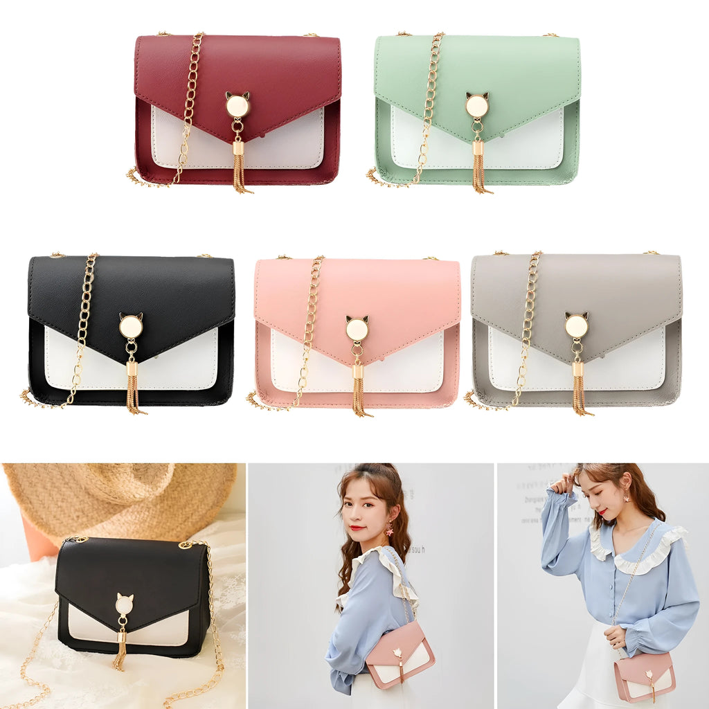 Small square PU leather messenger bag with cat tassel decoration and chain strap on a white background
