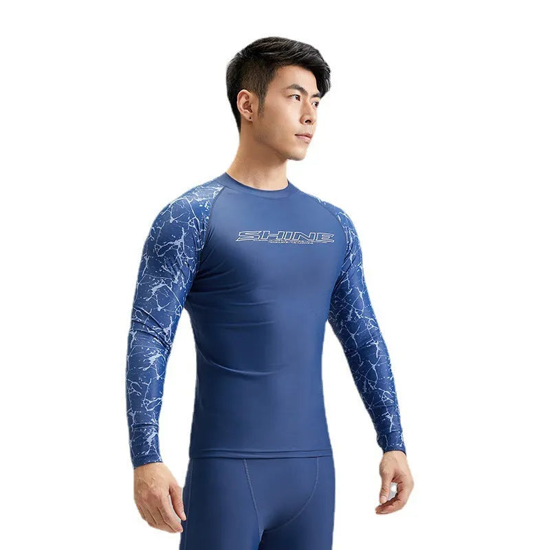 Men's dark blue patterned nylon swimwear set with matching top and trousers