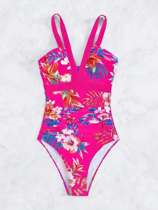 Women's floral pattern one-piece swimsuit with a backless design on a mannequin