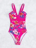 Women's floral pattern one-piece swimsuit with a backless design on a mannequin
