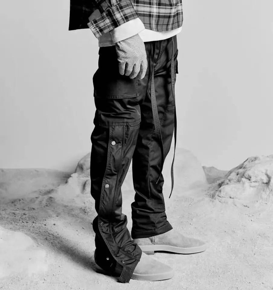 Men's cotton cargo pants with green colour, straight leg, and Velcro button closure on black background