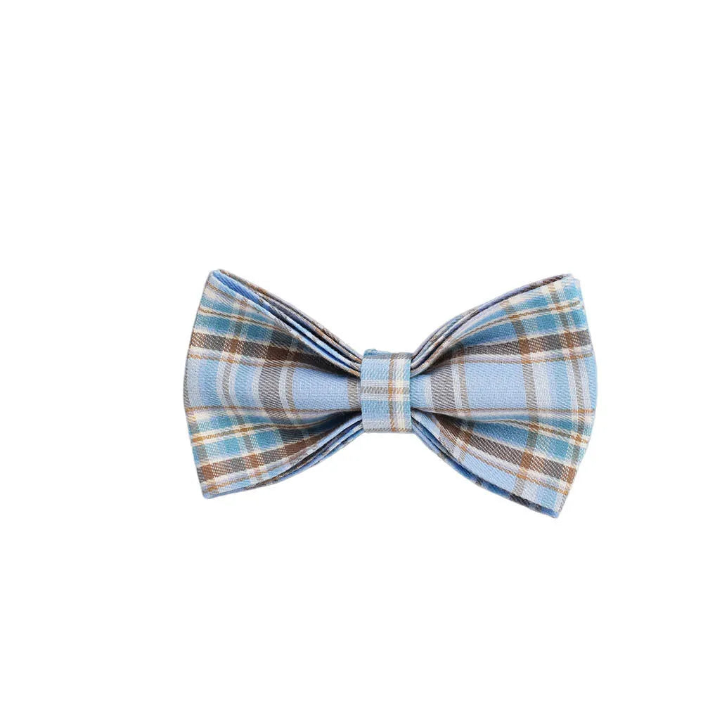 Sky blue grid forest pattern dog collar, leash, bow, and vest four-piece set on white background