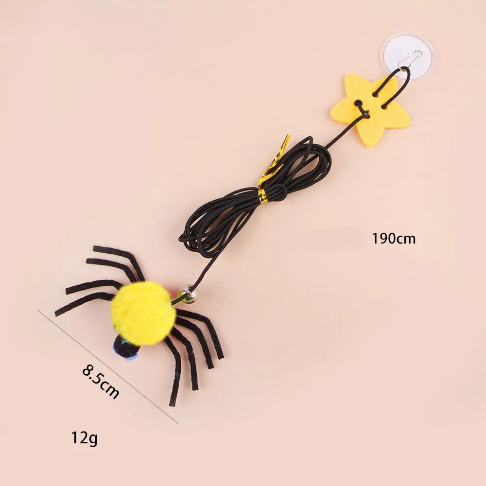 Red and yellow hanging cat toy with elastic rope, feather ball, bell and spider attachment for door mounting
