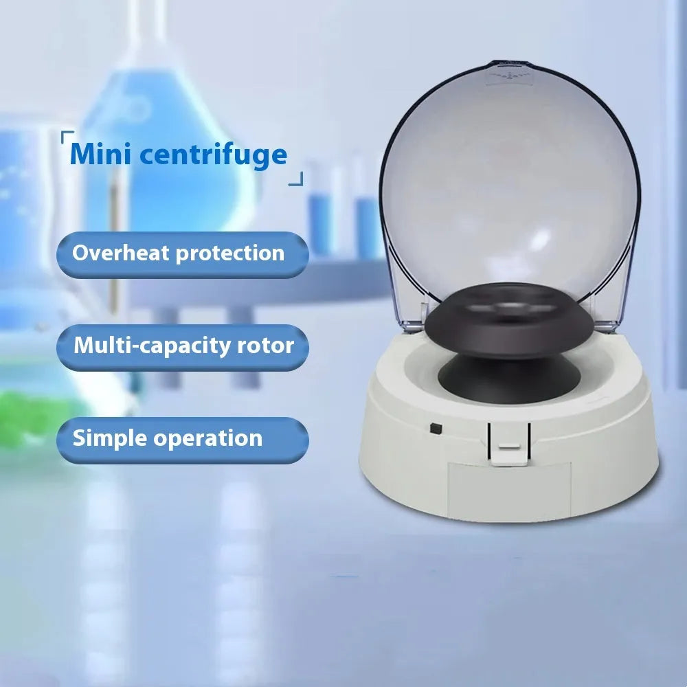 Small white mini laboratory centrifuge with digital display on a benchtop.