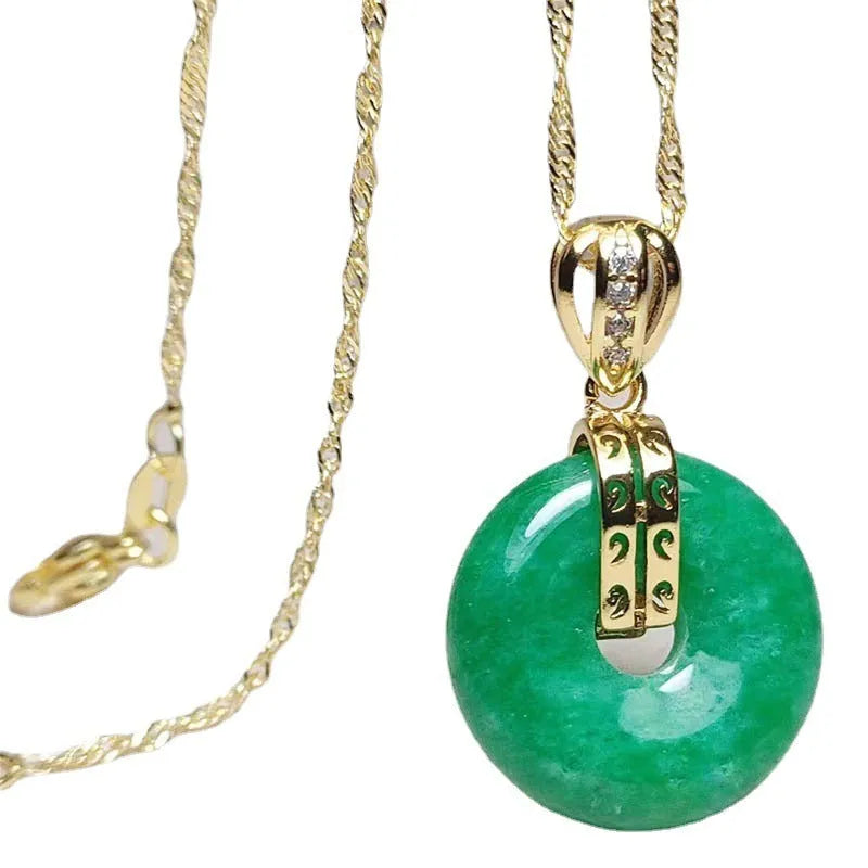 Vacuum electroplated emerald green jade pendant in safety buckle shape on white background