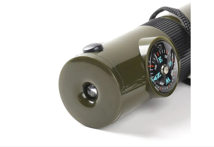 Outdoor Professional Seven-in-one Multifunctional Survival Whistle in army green with compass and whistle features