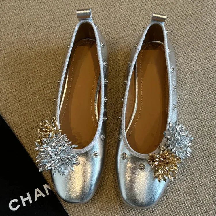 Women's silver buckle Mary Jane casual shoes with a flat rubber sole and sheepskin upper.