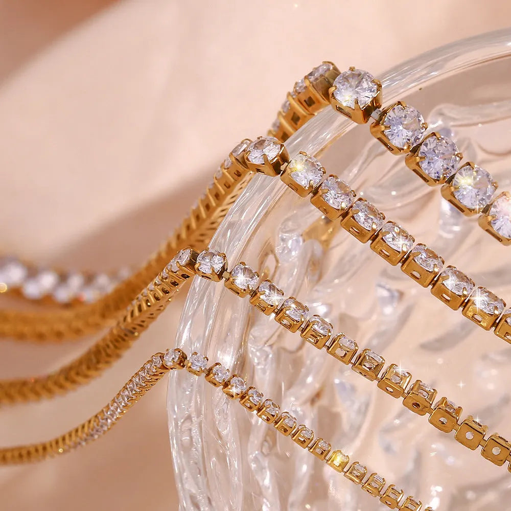 Stainless steel zircon necklace and bracelet set with 2-5mm stones and gold or silver titanium steel pendant
