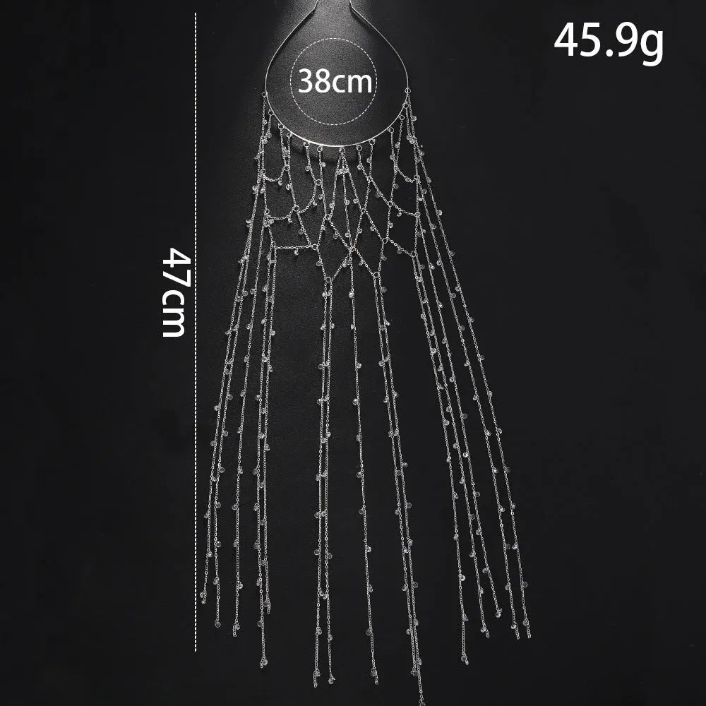 Close-up of a gold rhinestone mesh headband for women with a dangling tassel decoration.