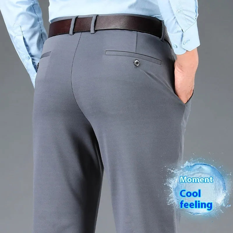 Men's straight-leg business casual trousers in elastic fabric, shown in black, available in waist sizes 29 to 52 inches.