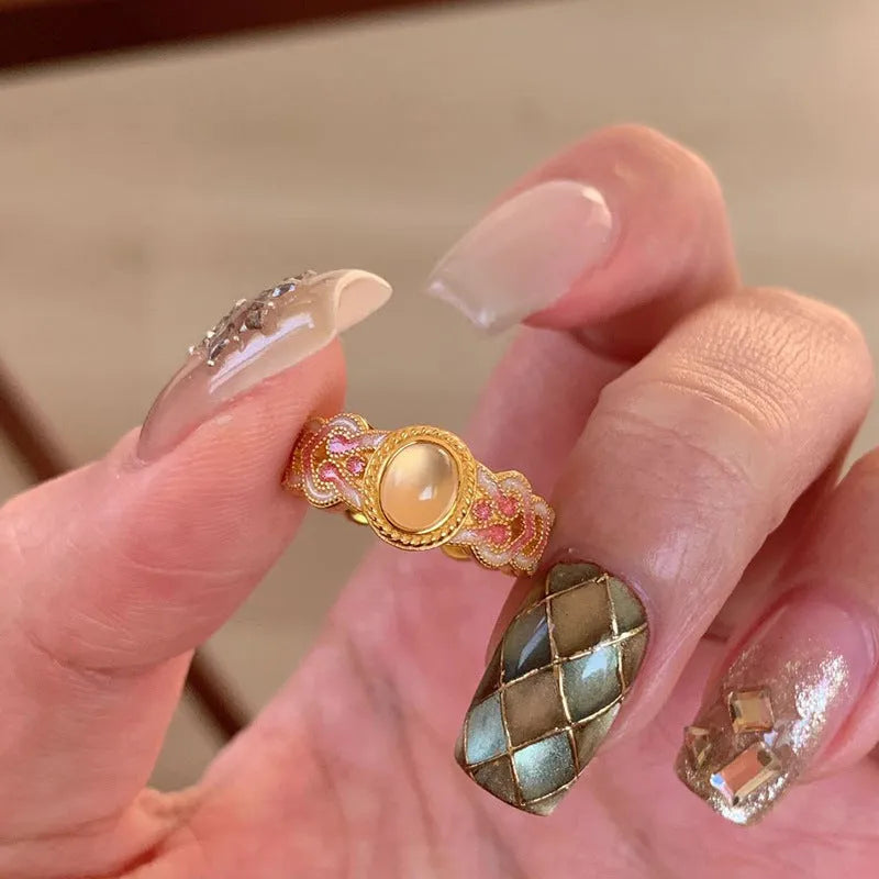 Women's geometric open ring with pink crystal enamel on gold-plated copper band