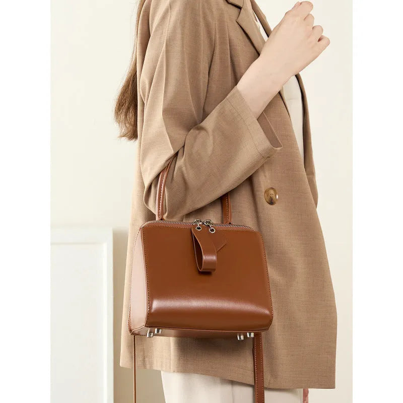 Open grain leather handbag with cowhide lining and welt pocket in black, brown or creamy white