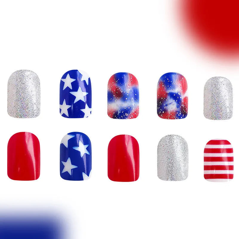 Independence Day nail art stickers with red, white, and blue five-pointed star designs on short square nails.