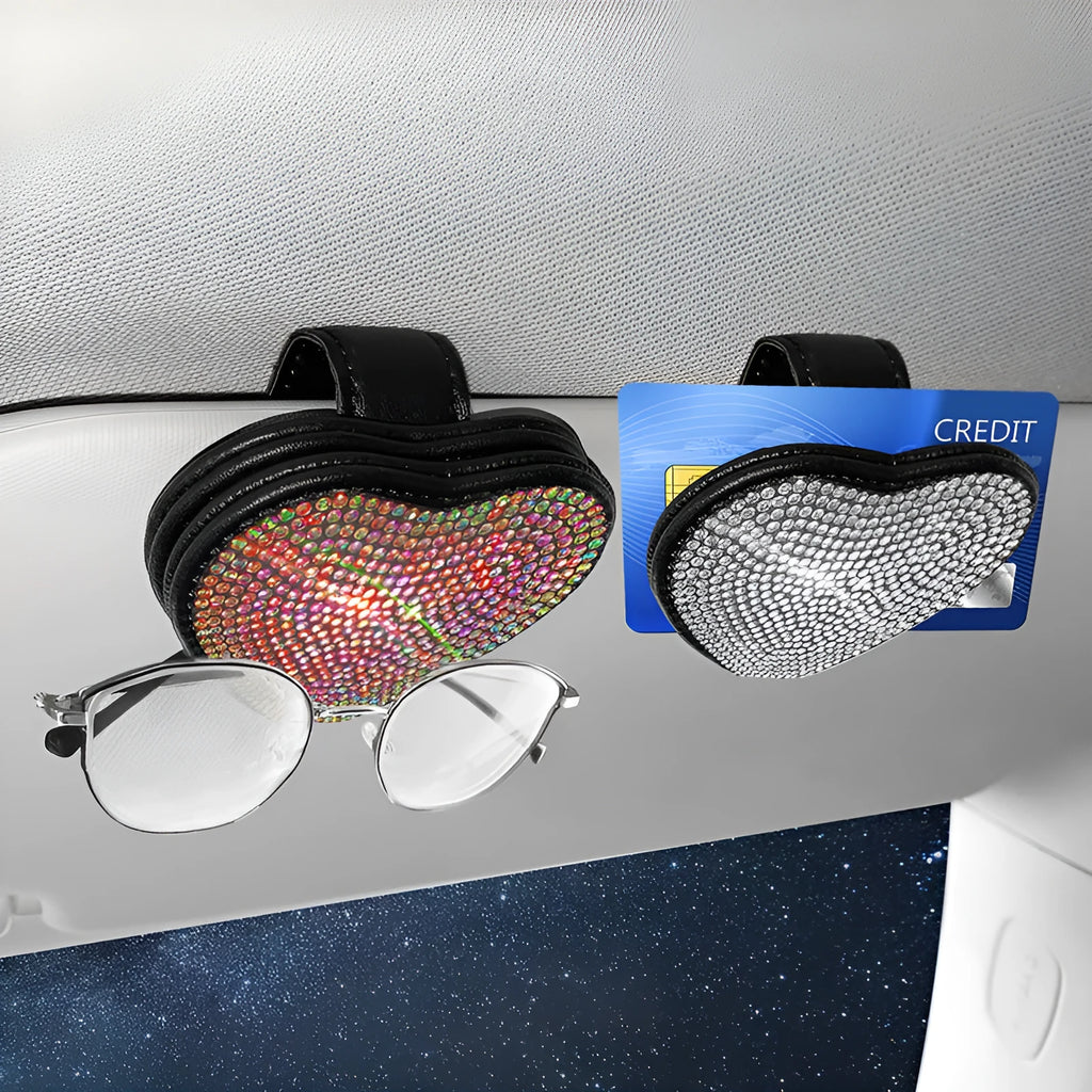 A black PU leather magnetic storage clip with a diamond pattern on a car sun visor, holding a pair of sunglasses.